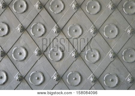 Metal gate texture with old pattern. Rusty gray background