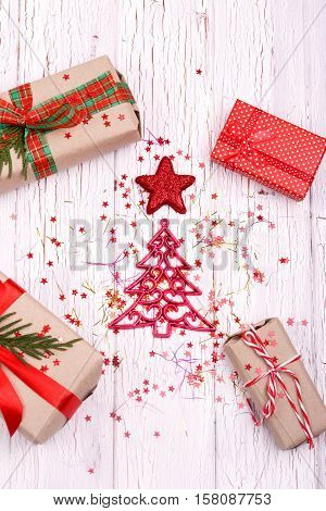 Beautiful Christmas Decorations And Packeged Gift Boxes Lying On White Floor
