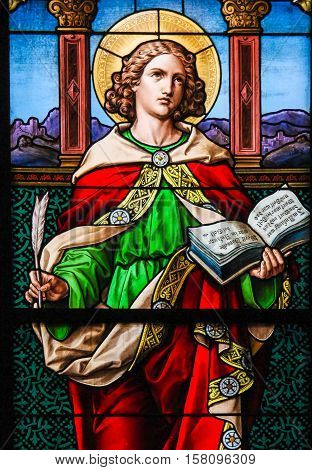 STOCKHOLM SWEDEN - APRIL 16 2010: Saint John the Evangelist. Stained glass windowin the German Church in Gamla Stan Stockholm.