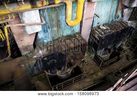 Abandoned, destroyed by war and owergrown machinery of Tkvarcheli power plant, Abkhazia, Georgia