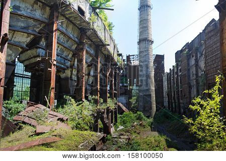 Abandoned, destroyed by war and overgrown machinery of Tkvarcheli power plant, Abkhazia, Georgia