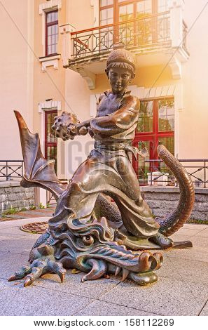 Kiev Ukraine - 20 October 2016: Statue of Ukrainian faitytale character Kotygoroshko or Pokatigoroshek beating up the Dragon.