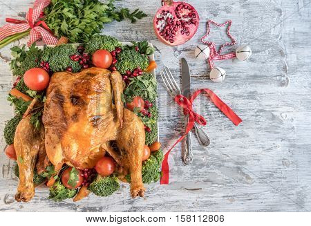 Roasted chicken with baked vegetables, Christmas concept