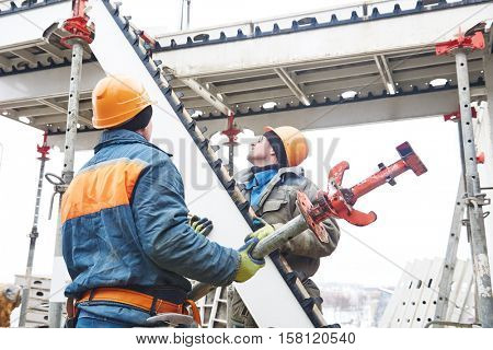 worker installing falsework construction