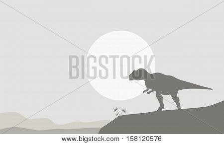 Silhouette of mapusaurus on the cliff landscape vector