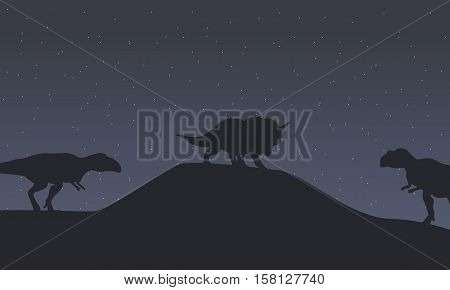 Silhouette of mapusaurus and triceratops dinosaur scenery illustration
