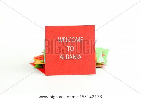 picture of a red note paper with text welcome to albania