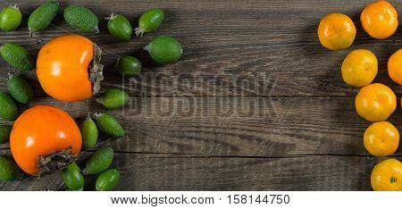 Mixed exotic fruits on wooden background. Close up