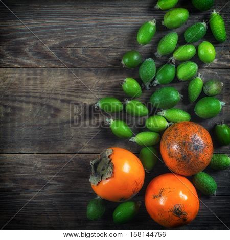 Mixed exotic fruits on wooden background. Close up