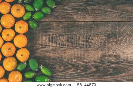 Mixed exotic fruits on wooden background. Close up