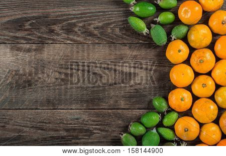 Mixed exotic fruits on wooden background. Close up