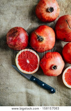 Ripe Pomegranate Fruit On Wooden Vintage Background. Red Juice P