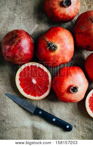 Ripe Pomegranate Fruit On Wooden Vintage Background. Red Juice P