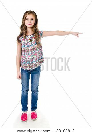 Cute little girl is pointing to the side isolated on a white