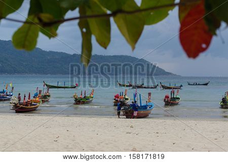 RAWAI BEACH PHUKET ISLAND THAILAND - FEBRUARY 28 2016: long tailed boat at exotic Bay of Rawai in Phuket island Thailand