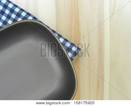 Top view plate on checkered tablecloth pattern background .Free space for products and for your text