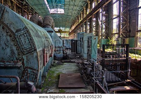 Abandoned, destroyed by war and overgrown machinery of Tkvarcheli power plant, Abkhazia, Georgia