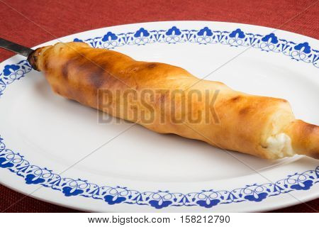 Freshly baked hachapuri with bacon and cheese