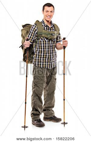 Full length portrait of a man in sportswear with backpack and hiking poles isolated on white background