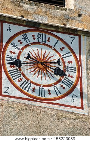Detail of the clock tower of the ancient Benedictine convent of Saint John (UNESCO world heritage site) in Monastery valley Mustair Grisons Switzerland