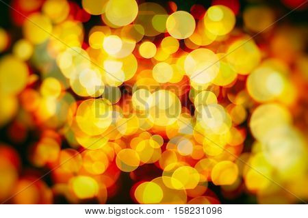 Abstract Festive background. Glitter vintage lights background with lights defocused. Christmas and New Year feast bokeh background with copyspace.