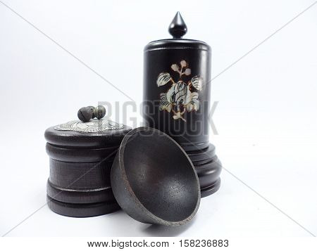 The wooden round box made of aromatic wood and dye them black with the silver and pearl engraving.