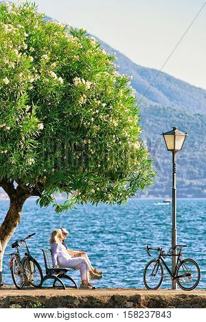 Couple Sitting On Bench In Ascona Of Ticino Canton Switzerland