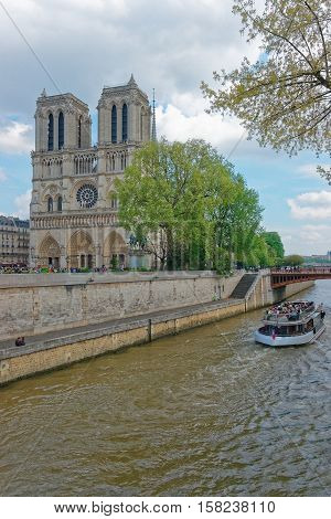 Dame De Paris Cathedral Boat And Seine River Embankment
