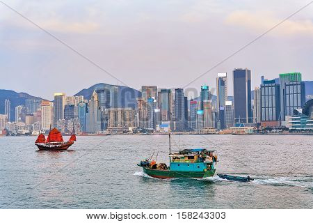 Junk Boat At Victoria Harbor Of Hk At Sundown