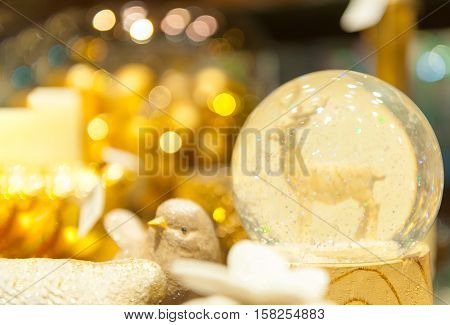 Christmas snow globe with an deer in snow inside of spere