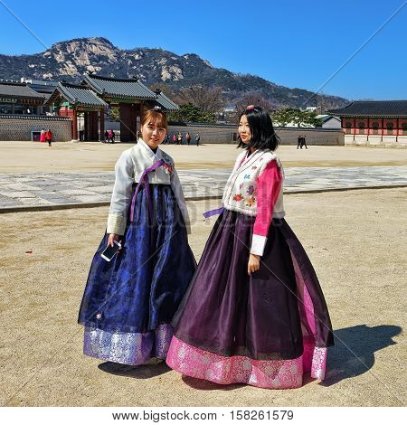 Young Girls In Traditional Costumes At Gyeongbokgung Palace In Seoul