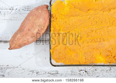 Oven Meal With Sauerkraut And Sweet Potato On Wooden Background