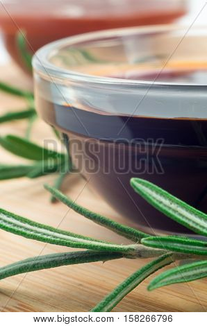 Soy Sauce In A Glass And A Sprig Of Rosemary