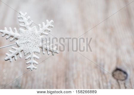 White snowflake ovr white vintage wood and copy space