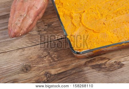 Oven Meal With Sauerkraut And Sweet Potato On Wooden Background