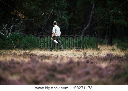 Forester Spreading Food For Red Deer In Rutting Season. National Park Hoge Veluwe.