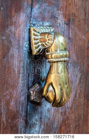 Antique door-knocker on old door in Spain, Majorca