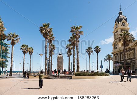 Adelaide Australia - August 28 2016: Many tourists and visitors wandering around the square at Adelaide beachside suburb of Glenelg Australia.