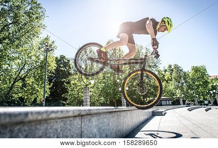 Young athlete making tricks on his bicycle