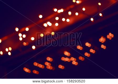 Abstract colorful blurry background cold and warm colors tone cinematic effect evening night street romantic lights