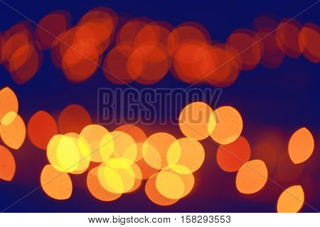 Abstract colorful blurry background cold and warm colors tone cinematic effect evening night street romantic lights