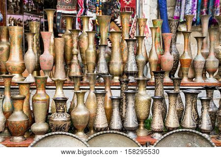 Old oriental antiques barass vases on street market in Baku, Azerbeijan.