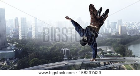 B-boy performing some moves . Mixed media