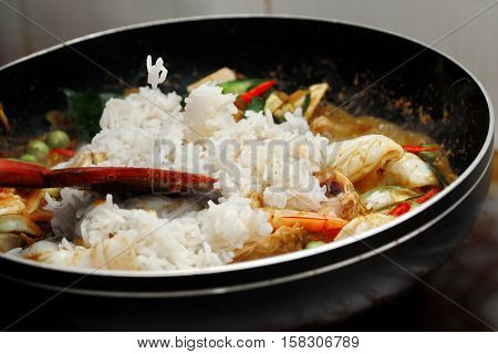 Cooking ,fried Jasmine Rice In Green Curry With Mixed Meat.