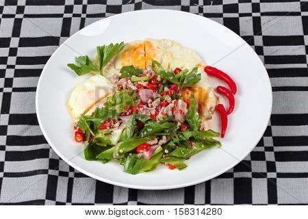 Thai Food,spicy Wing Bean With Pork Topped Fried Egg.