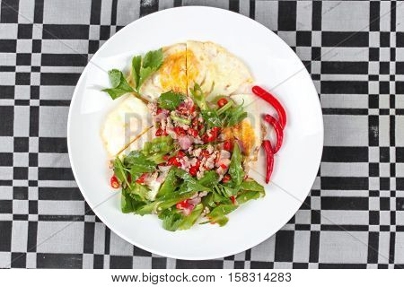 Thai Food,spicy Wing Bean With Pork Topped Fried Egg.