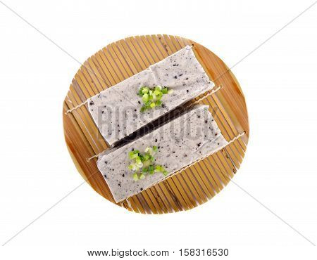tofu mix black sesame seeds on bamboo mat with white background