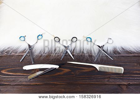 Hairdresser set with various accessories on background