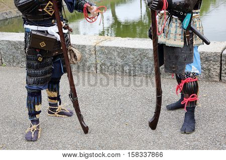 KAGAWA, JAPAN - NOVEMBER 20: Ancient firelock rifle fighters at Marugame Historical battle Festival, event dedicated to Japanese culture and tradition at Marugame-castle on November 20, 2016 in Japan.