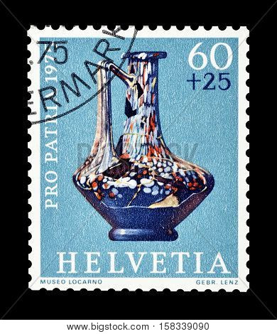 SWITZERLAND - CIRCA 1975 : Cancelled postage stamp printed by Switzerland, that shows Henkel glass jar.